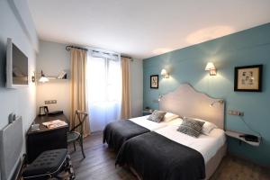 Voodi või voodid majutusasutuse The Originals Boutique, Hôtel du Parc, Cavaillon toas