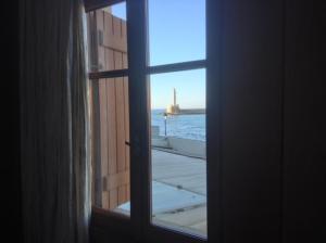 a window with a view of a balcony at Villa Venezia in Chania