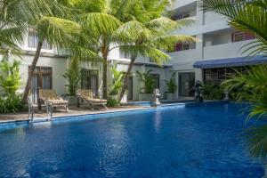 Kolam renang di atau di dekat Wyndham Garden Kuta Beach Bali