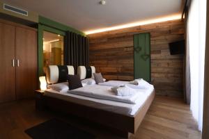 Postel nebo postele na pokoji v ubytování ALIA appartements & wellness