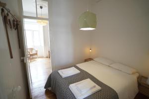 Ένα ή περισσότερα κρεβάτια σε δωμάτιο στο Mouraria Apartments