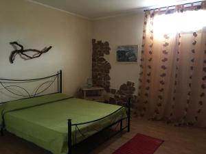 Cama o camas de una habitación en Casa Vacanze Gli Oleandri