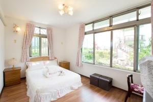 Postel nebo postele na pokoji v ubytování Taitung Moon House