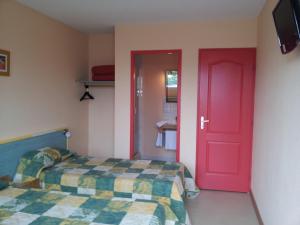 Postel nebo postele na pokoji v ubytování Tour Hôtel