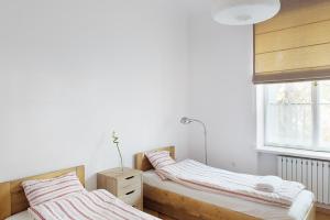 Posteľ alebo postele v izbe v ubytovaní Bednarska Old Town Apartment