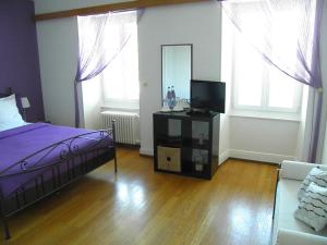 Postel nebo postele na pokoji v ubytování Auberge au Cavalier
