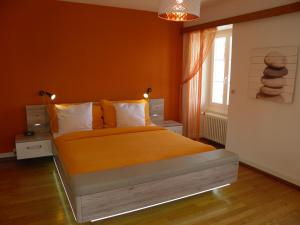 Postel nebo postele na pokoji v ubytování Auberge au Cavalier