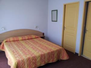 Postel nebo postele na pokoji v ubytování Tour Hôtel