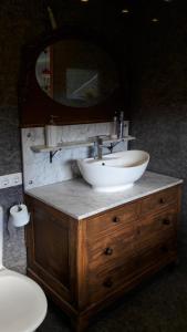 a bathroom with a vanity with a sink and a mirror at Vilnius Luxury Apartment 1 in Vilnius +24 photos