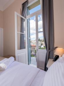 Postel nebo postele na pokoji v ubytování Palladian Home