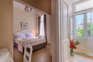 Postel nebo postele na pokoji v ubytování Palladian Home