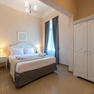 Postel nebo postele na pokoji v ubytování Palladian Home