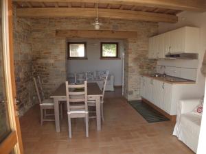 a kitchen and dining room with a table and chairs at Al Castello in San Severino Marche