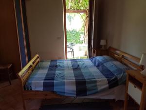 Łóżko lub łóżka w pokoju w obiekcie Villa La Torricella