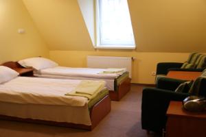 Postel nebo postele na pokoji v ubytování Gościniec Pan Tadeusz