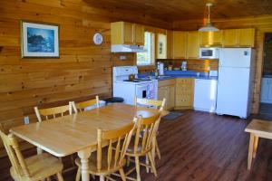 A kitchen or kitchenette at Swept Away Cottages