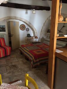 En eller flere senger på et rom på Trulli di Pozzomasiello