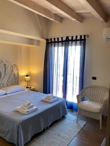 Voodi või voodid majutusasutuse La Terra dei Mari Room & Relax toas