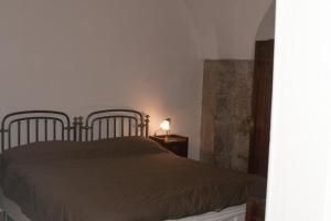 Postel nebo postele na pokoji v ubytování Palazzo D'Orsi