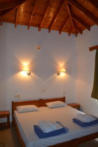 Posteľ alebo postele v izbe v ubytovaní Molivos Castle Apartments