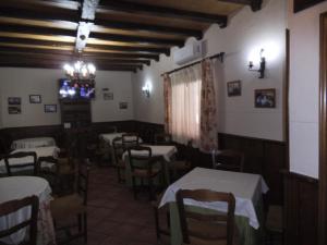 Reštaurácia alebo iné gastronomické zariadenie v ubytovaní Hostal Los Galgos
