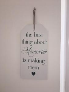 a sign hanging on a wall with the best thing about memories is making them at Mellitus Studio Apartment in Split