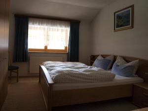 Postel nebo postele na pokoji v ubytování Bichlerhof