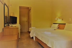 Katil atau katil-katil dalam bilik di Apollon Hotel