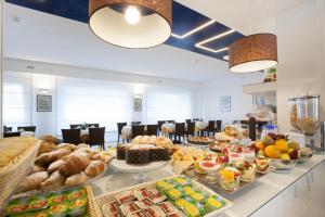 a buffet line with a lot of food on it at Hotel La Meridiana in Sorrento