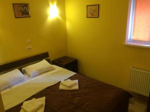Ένα ή περισσότερα κρεβάτια σε δωμάτιο στο Hotel Travel