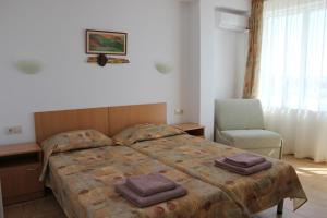 Postel nebo postele na pokoji v ubytování Hotel Radik