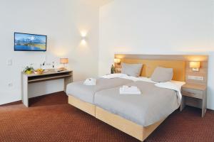 Ein Bett oder Betten in einem Zimmer der Unterkunft Villa Oranien