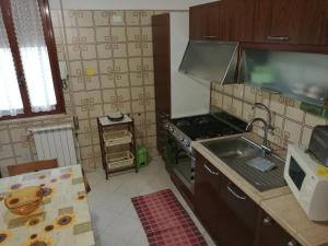 Kuchyňa alebo kuchynka v ubytovaní Casa Mia, vacanze