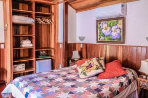 Cama o camas de una habitación en Pousada Vale das Hortensias