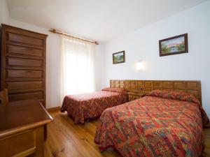 Postel nebo postele na pokoji v ubytování Hostal Pirineos Sarvisé