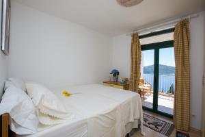 Un pat sau paturi într-o cameră la Ambassador Suite Dubrovnik