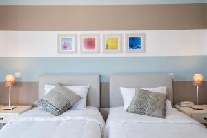 Postel nebo postele na pokoji v ubytování Hotel Oasis