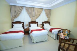 Кровать или кровати в номере Al Azhar Almassi Hotel