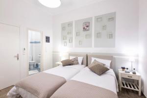 Postel nebo postele na pokoji v ubytování Hotel Oasis