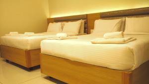 Postel nebo postele na pokoji v ubytování Hotel Ashoka