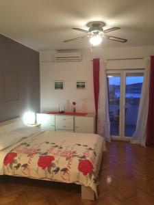 Postel nebo postele na pokoji v ubytování Apartments Perina