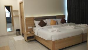 Postel nebo postele na pokoji v ubytování Hotel Ashoka