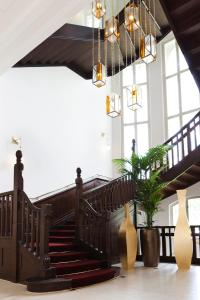 
a large staircase leading up to a balcony at Hotel Steirerschlössl in Zeltweg

