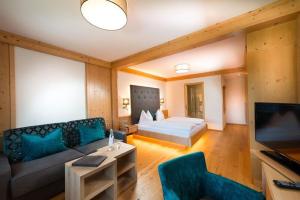 Postel nebo postele na pokoji v ubytování Hotel Alpina