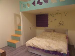 Postel nebo postele na pokoji v ubytování Lai Yi Ke B&B