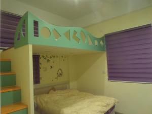 Postel nebo postele na pokoji v ubytování Lai Yi Ke B&B