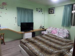 Postel nebo postele na pokoji v ubytování Lai Yi Ke B&B
