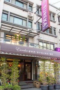 a building with a sign in front of it at Eureka in Tainan