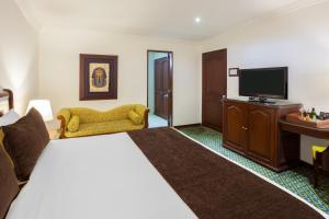 TV a/nebo společenská místnost v ubytování Hotel Embassy Park