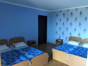 Voodi või voodid majutusasutuse Kvariati - Guest House toas